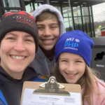 Beth and her two children with her Declaration of Candidacy paperwork