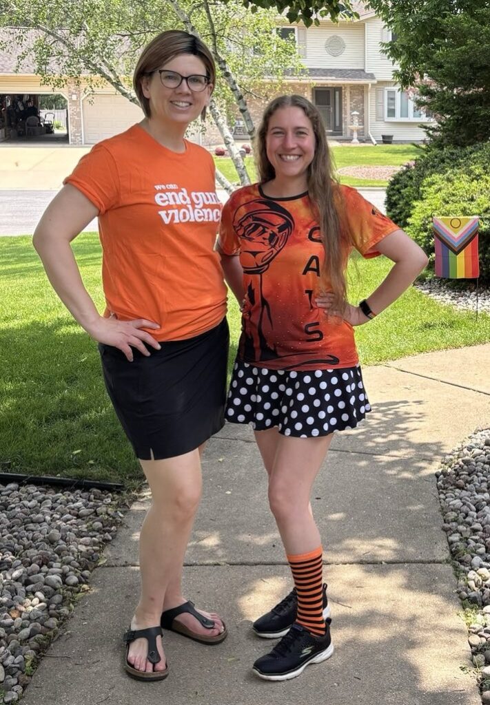 Alder Mara Helmke and Alder Beth Tucker Long wearing orange to promote awareness of gun violence.
