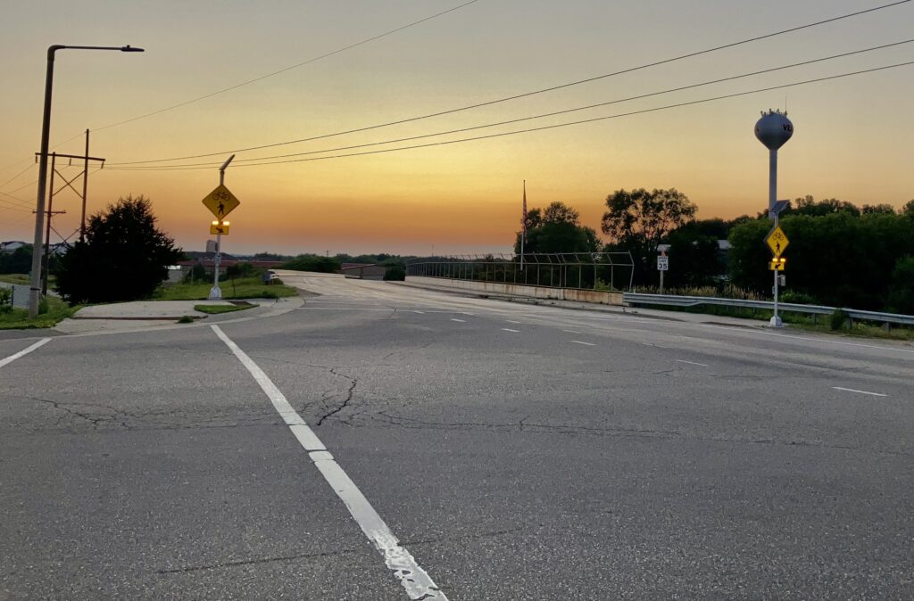 Photograph of the rectangular rapid flashing beacons at the corner of Range Trail and M